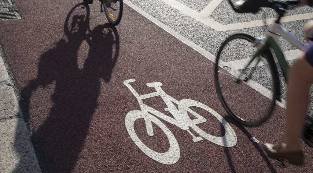 Cyclists cycling in the cycle lane.