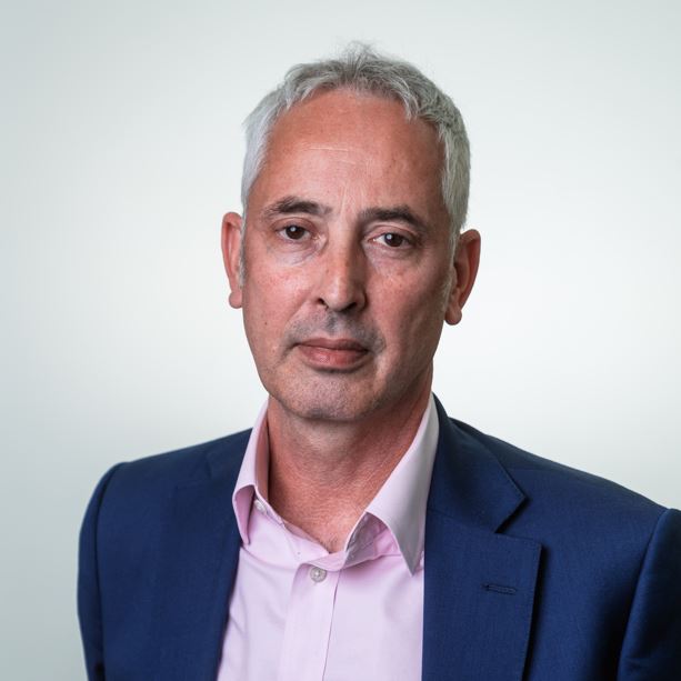 Portrait image of a white male wearing a suit shirt and blazer. The man in the photo is Rupert Clubb, Lead Officer at Transport for the South East.