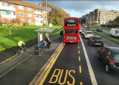 A decorative image of a bus in a bus stop